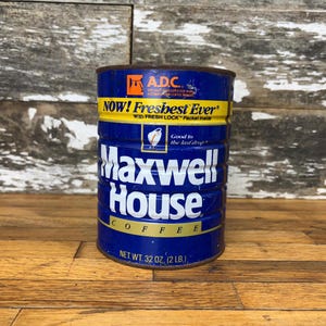 May include: A blue and yellow vintage Maxwell House coffee can with the text "NOW! Freshest Ever" and "Good to the last drop". The can is 32 ounces (2 pounds).