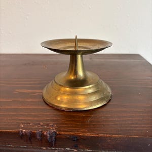 May include: A set of three ceramic mugs with a speckled, matte finish. Each mug features a different color: light blue, cream, and gray. The mugs have a simple, modern design and a comfortable handle.