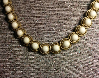 Choker style necklace white beads on gold tone setting 1970s