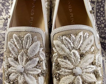 Beige and white Shoes slip ons Donald Pliner embossed floral rhinestone jeweled wedgies.