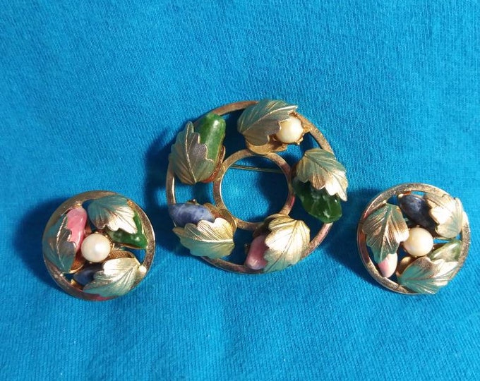 Sarah Coventry brooch and clip on earrings set.  Leaf design with coloured stones.60s
