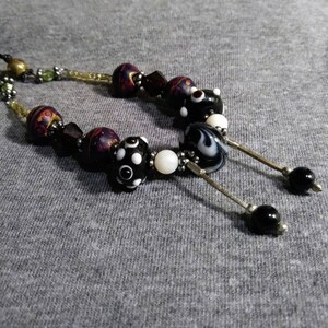 Necklace one of a kind. Beaded whimsy. Bits and pieces of Vintage jewelry redesigned into unique wearable art. Artist Heather Hutcheson