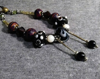 Necklace one of a kind. Beaded whimsy. Bits and pieces of Vintage jewelry redesigned into unique wearable art. Artist Heather Hutcheson