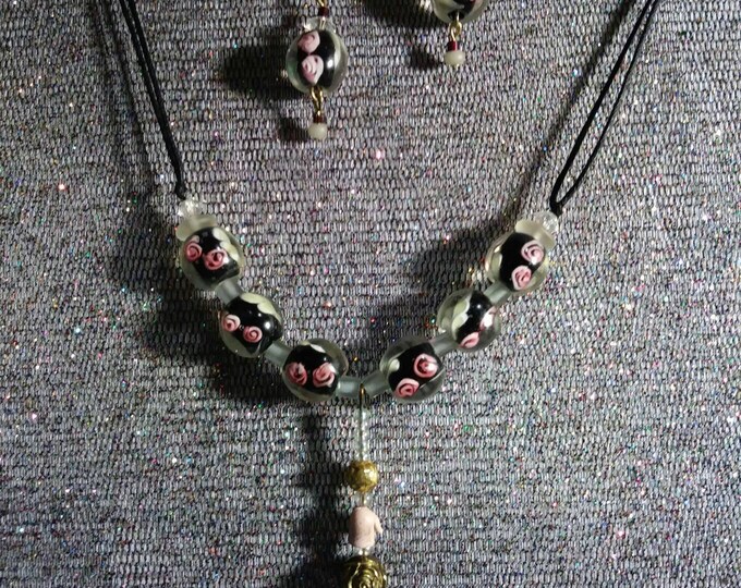 Lampwork glass bead jewelry. One of a kind redesigned into wearable art by Artist Heather Hutcheson.