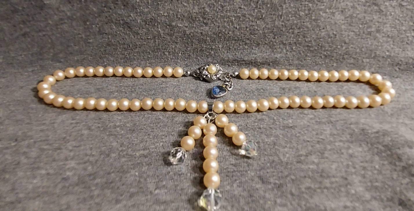 I bought this pearl necklace in an online estate auction. It was broken but  I loved the 14k and seed pearl clasp so much that I learned how to restring  them myself.