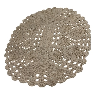 May include: A beige, oval-shaped, crocheted doily. The doily features a detailed openwork design with a scalloped edge. The central section is a solid, rectangular shape, and the overall texture is soft and handmade.