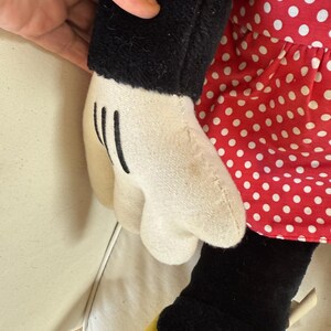 This vintage Disneyland Minnie Mouse plush stands tall at 30 inches, bringing a touch of whimsy and nostalgia to any room or Disney fan collection.
