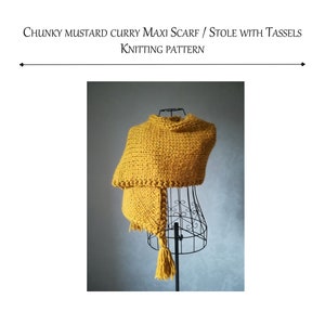 May include: A mustard yellow chunky knit maxi scarf or stole with tassels, displayed on a wire mannequin. The scarf is made of thick yarn and has a textured appearance. The image includes the text "CHUNKY MUSTARD CURRY MAXI SCARF / STOLE WITH TASSELS KNITTING PATTERN".