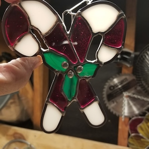 Apanhador de sol em bastão de doces com vitral