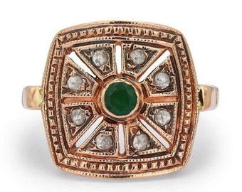 May include: A gold ring featuring a square emerald green stone surrounded by smaller diamonds in a geometric design.