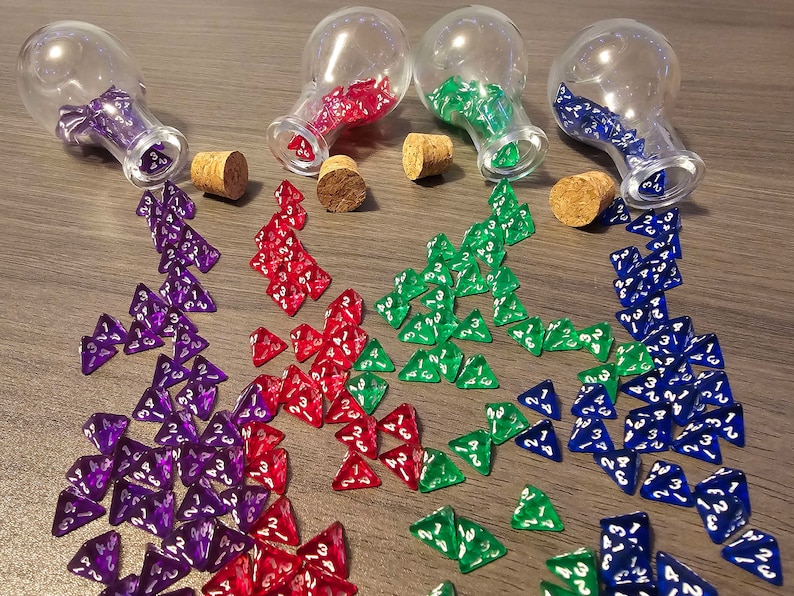 May include: Four glass bottles with cork stoppers are tipped over, spilling out a large number of iridescent dice. The dice are in four colors: purple, red, green, and blue.