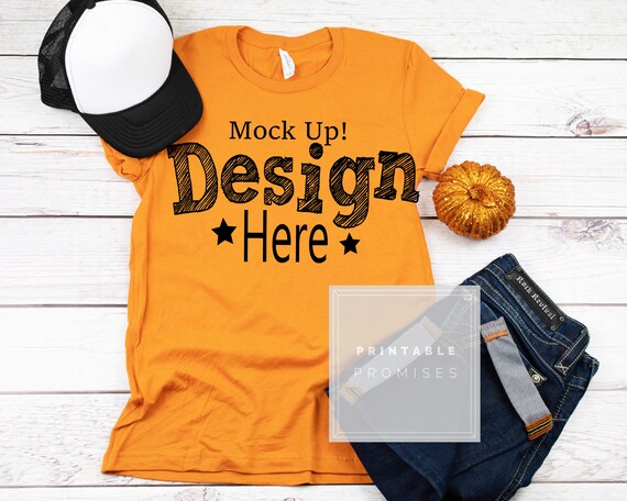 Orange Halloween T-Shirt Mockup With Trucker Hat Jeans Orange Halloween T-Shirt Mockup With Trucker Hat Jeans