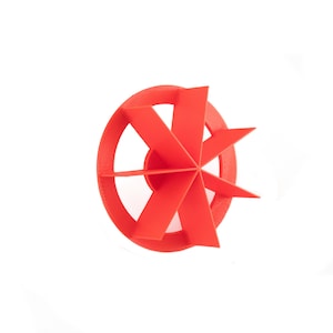 May include: A red plastic fan with six blades. The fan is circular and has a hole in the center.