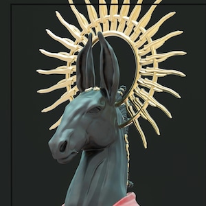 May include: A dark gray donkey sculpture with a gold halo and accents. The donkey wears a red garment. The sculpture is set against a black background. The halo has a sunburst design.