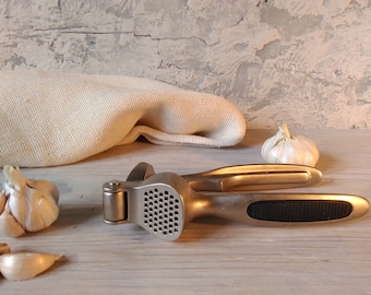 Crushing garlic,metal juicer  garlic press ,vintage garlic press and nutcracker , hand juicer crusher