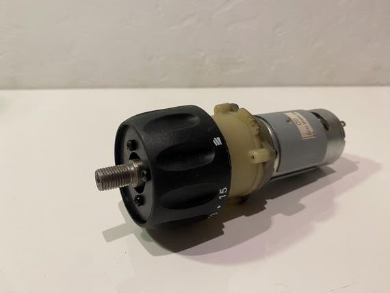 12-volt electric motor with gearbox.