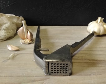 Crushing garlic,metal juicer  garlic press ,vintage garlic press and nutcracker , hand juicer crusher