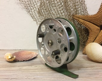 Small spinning reel, vintage, fishing tackle, showcase decor.