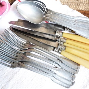 Art deco table cutlery, antique table knives, vintage art deco spoons and forks, art deco vintage table utensils, French table silverware.