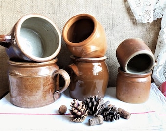 Collection of stoneware pots, old stoneware farmhouse jugs, French stoneware tradition, vintage decoration stoneware rustic kitchen pots.