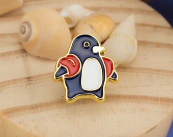 Paranoid Penguin Enamel Pin - A penguin chick taking its first swim with arm floaties