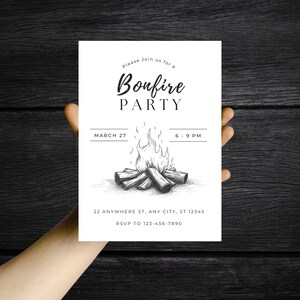 May include: A white invitation card with the text "Bonfire PARTY" in a script font. The card features a detailed illustration of a bonfire with flames and logs. Additional text includes the date, time, and RSVP information.