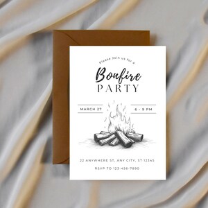 May include: A white invitation card with the text "Bonfire Party" and a detailed illustration of a bonfire. The card includes event details: March 27, 6-9 PM, and an RSVP number. A brown envelope is behind the card.