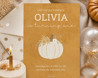 May include: A rectangular invitation card with a mustard yellow background featuring the text OUR LITTLE PUMPKIN OLIVIA is turning one. The card displays a white pumpkin illustration with floral accents, event details for Saturday Jun. 3, 2027, and RSVP info.