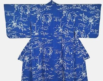 May include: A blue kimono with a white floral pattern. The kimono is hanging on a white background. The sleeves are wide and the fabric is lightweight. The design is a traditional Japanese style.