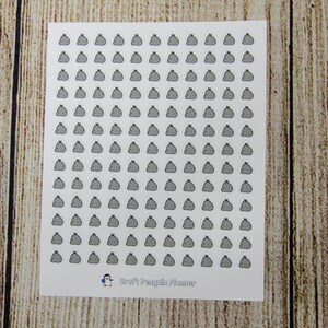 May include: A sheet of white sticker paper with a repeating pattern of gray trash can icons. The sheet is labeled "Craft Penguin Planner" at the bottom.