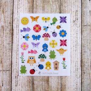 May include: A sheet of colorful stickers featuring various spring-themed designs, including butterflies, flowers, birds, mushrooms, ladybugs, and a sun. The stickers are perfect for adding a touch of whimsy to crafts, journals, and other projects.