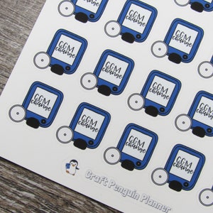 May include: Sheet of stickers featuring a blue CGM device design with the text "CGM change" in a handwritten style font. The stickers are arranged on a white background, with a Craft Penguin Planner logo at the bottom.