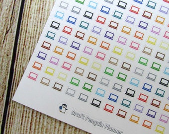 May include: A sheet of colorful laptop stickers with a white outline. The stickers are arranged in rows and columns. The sheet includes a small penguin sticker with the text "Craft Penguin Planner".