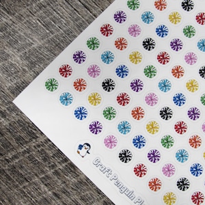 May include: Sheet of colorful stickers with a floral design in various colors, including red, blue, green, and purple. The stickers are arranged on a white background, with a small penguin logo and the text "Craft Penguin Pl..." at the bottom.