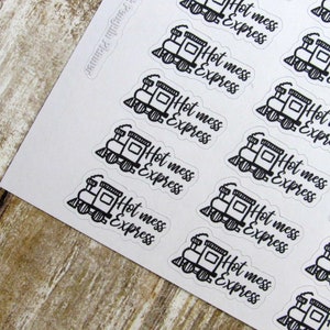 May include: A sheet of stickers with a black and white illustration of a train engine. The text on the stickers reads "Hot mess express".