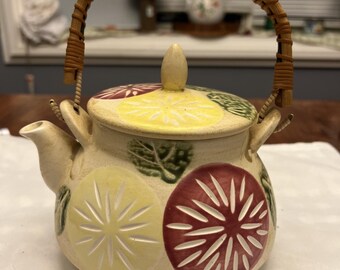 Vintage Yellow Stoneware Teapot with Pink and Green Design, Wicker Handle, Plant