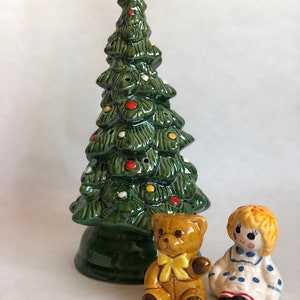 Hand painted (made in brazil) by Avon  vintage small ceramic christmas tree for use with light or serve from. Spice shakers included.