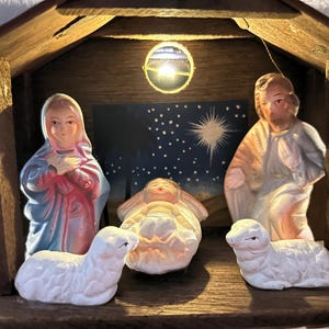 Vintage desktop or small area nativity scene. Made in Japan. Has a hole for placing a Christmas light in to light it up.
