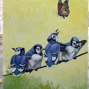 May include: A painting of four blue jays perched on a wire, with a monarch butterfly flying above them. The birds have blue and white feathers, and the background is yellow and green. The painting is signed "Jacob Bates Abbott".