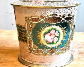 Vintage baret ware metal round tin with flowers and pink/turquoise pattern