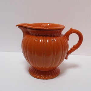 Stangl Tangerine Colonial Covered Pitcher,  Rare but some damage.