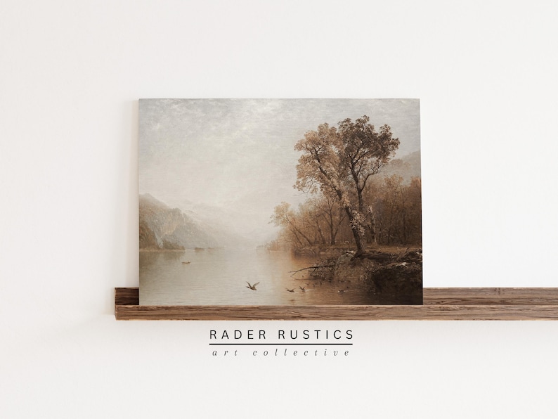 The image is a painting of a serene landscape with a lake, trees, and mountains in the background.