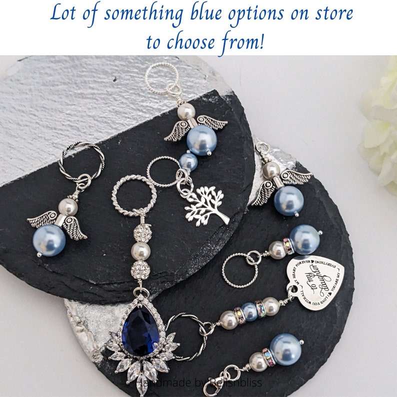 May include: Several keychains with blue pearl beads, silver accents, and charms, including angel wings, a tree, and a heart. The text "Lot of something blue options on store to choose from!" is visible.