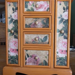 Refurbished vintage jewelry box. Hand painted in a pumpkin color. One of a kind design. Victorian style details have been added .