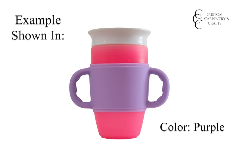 May include: Purple silicone cup holder with two handles. The cup holder is designed to fit around a standard-sized cup. The cup holder is shown with a pink cup inside.