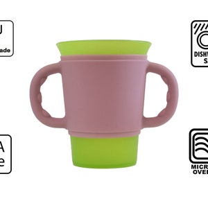 May include: A pink silicone cup with two handles and a green silicone lid. The cup is BPA free and dishwasher, microwave, and oven safe. The cup is food grade.