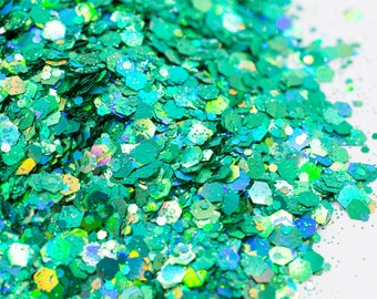 May include: A close-up of iridescent green glitter, perfect for crafting and adding sparkle to projects.
