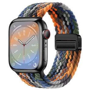 May include: A black Apple Watch with a multi-coloured braided band. The watch face is a gradient of orange, yellow, and green with a red second hand.