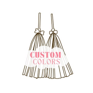 May include: Two white tulle fabric bows with black ribbon ties and the text "CUSTOM COLORS" in pink letters.