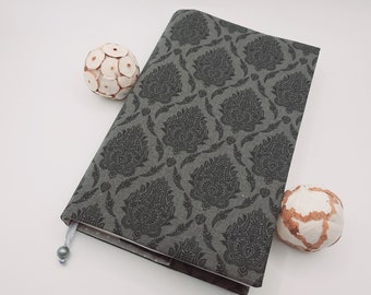 Book cover made of fabric various sizes variable width adjustable ornaments dots